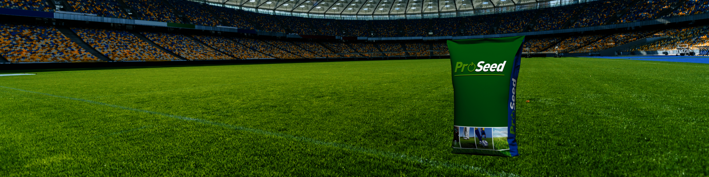 A bag of ProSeed seeds standing in the middle of the turf of an empty football stadium. 